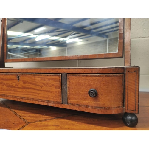 487 - Georgian satinwood dressing mirror, the swing mirror on shaped table base with fitted drawers and ra... 