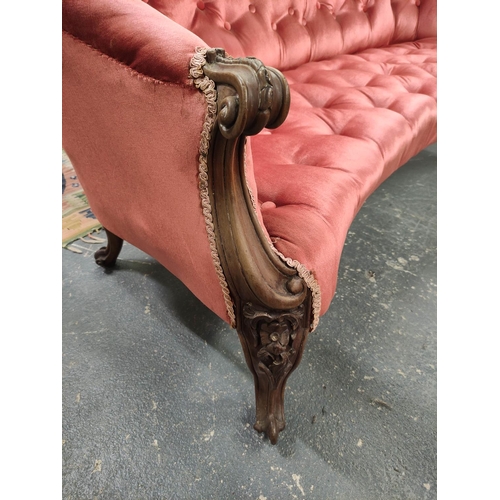 518 - Victorian mahogany scroll end sofa, upholstered in later pink button back velour, with scroll arm re... 