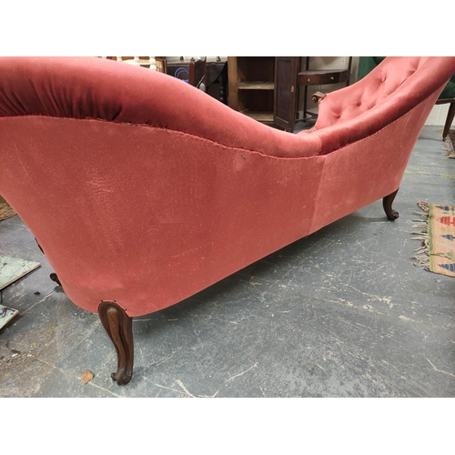 518 - Victorian mahogany scroll end sofa, upholstered in later pink button back velour, with scroll arm re... 