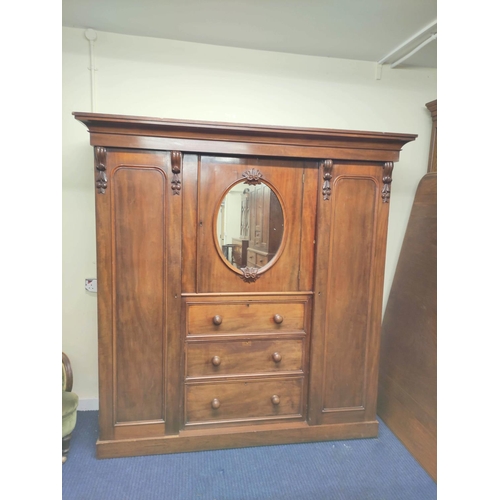 504 - Victorian mahogany wardrobe with moulded cornice above door with mirrored panel above three drawers,... 