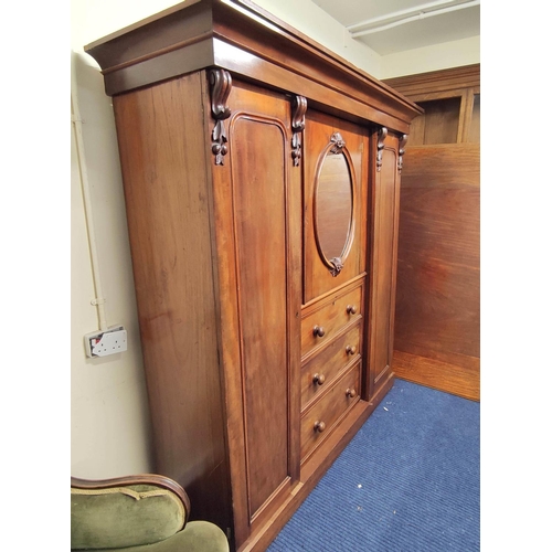 504 - Victorian mahogany wardrobe with moulded cornice above door with mirrored panel above three drawers,... 