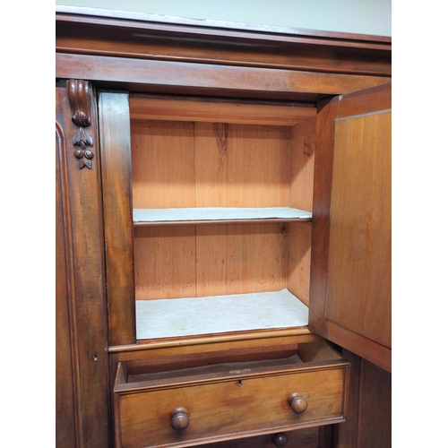 504 - Victorian mahogany wardrobe with moulded cornice above door with mirrored panel above three drawers,... 