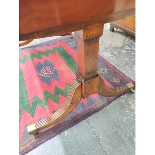 509 - 19th century mahogany library table the rectangular table with extending drop flaps, with three smal... 