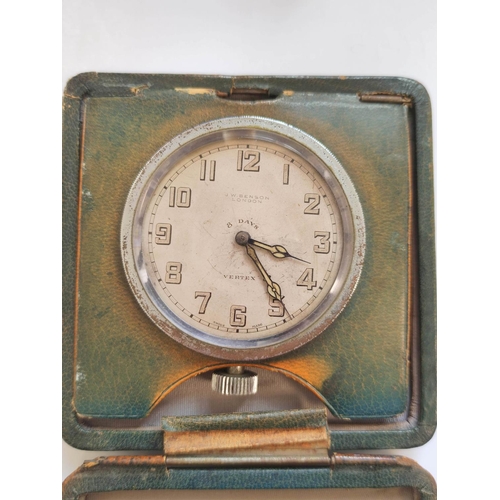 190 - Travelling clock by Benson London, in folding square leather case with gilt monogram 