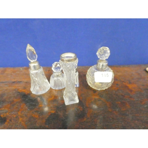 185 - Various antique cut glass scent bottles.