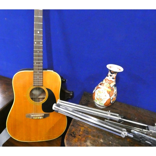 203 - Jumbo acoustic guitar and two music stands.