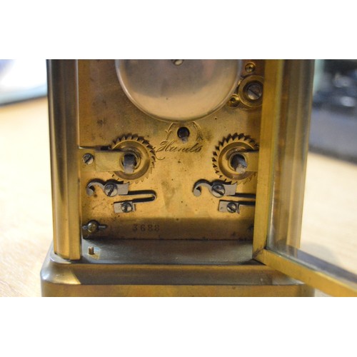 189 - Brass four glass carriage clock with movement viewing window to the top, 12cm high, with tooled case... 