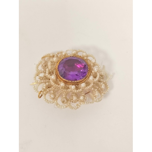 181 - Early 19th century seed pearl brooch with foiled amethyst in gold, upon mother of pearl.