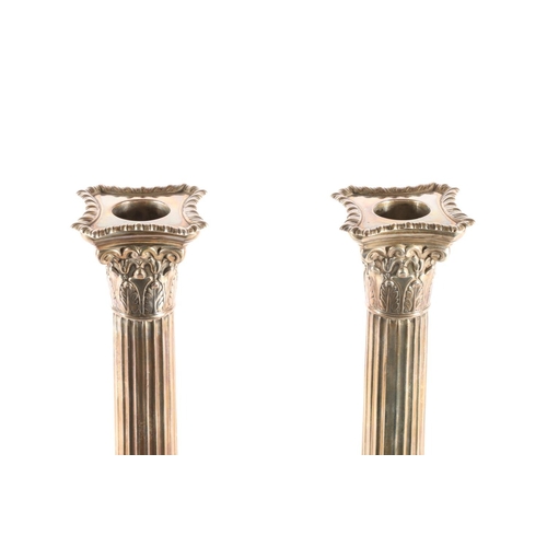 52 - Pair of Victorian silver weighted candlesticks, modelled as Corinthian Columns on stepped bases, Map... 