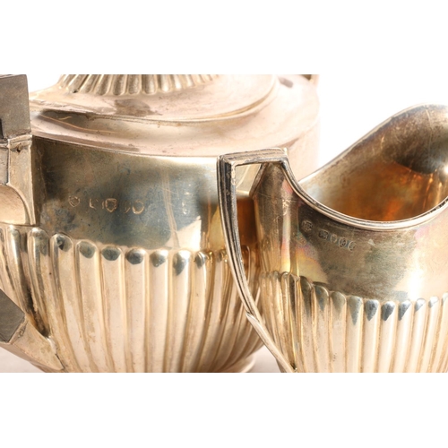 55 - Victorian four-piece silver tea and coffee service, of half fluted tapering form with ebony finials ... 