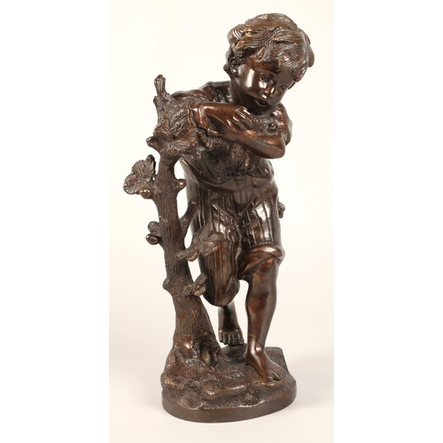 232 - Bronzed figure of a boy leaning on a tree stump on naturalistic base