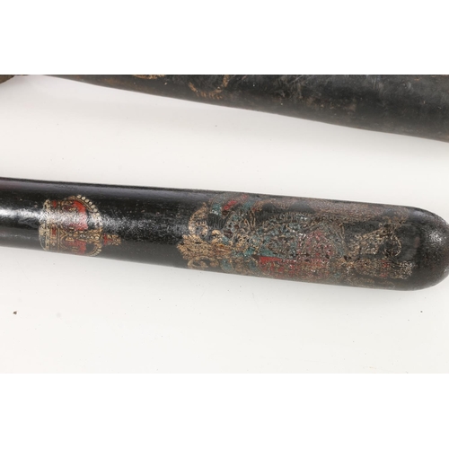 1523 - British truncheon with painted British coat of arms above crown, held in a stitched leather truncheo... 