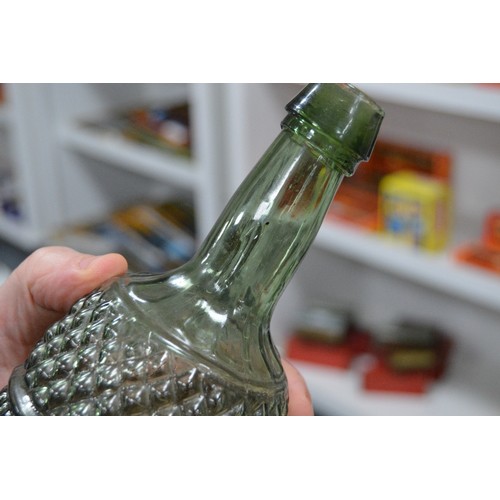 251 - 19th century green glass gurgle bottle decanter with pewter top, 35.5cm high, and two further green ... 