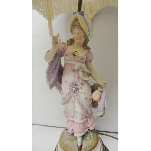 222 - Continental bisque table lamp, c. early 20th century, modelled as a classical maiden in dress, paint... 