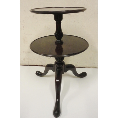 401 - George III mahogany dumb waiter with two graduated saucer tiers, on reeded baluster columns, tripod ... 