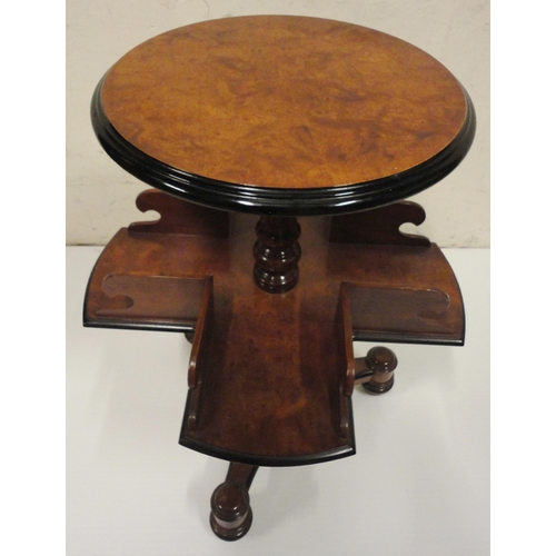 402 - Victorian burr walnut reading table, the saucer top with ebonised border above a galleried four-divi... 