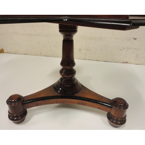 402 - Victorian burr walnut reading table, the saucer top with ebonised border above a galleried four-divi... 