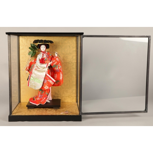 Japanese doll in glass display case, 44cm height of case