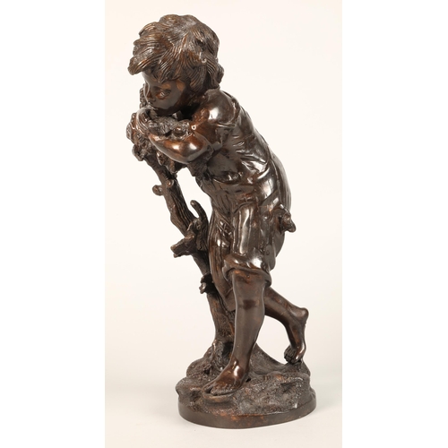 232 - Bronzed figure of a boy leaning on a tree stump on naturalistic base