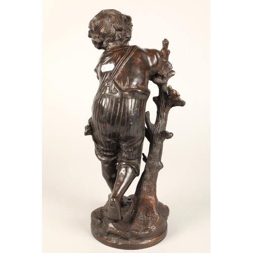 232 - Bronzed figure of a boy leaning on a tree stump on naturalistic base