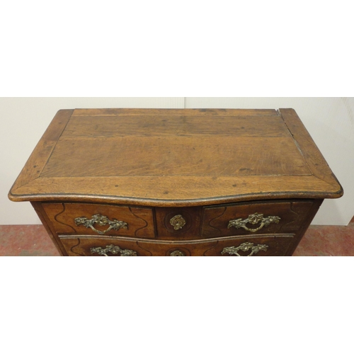 404 - Antique French provincial oak serpentine chest of two short and two long drawers, iron locks to the ... 