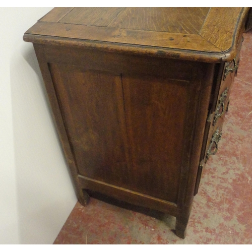 404 - Antique French provincial oak serpentine chest of two short and two long drawers, iron locks to the ... 