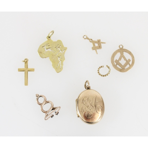 515 - 9ct gold locket, Africa pendant, two masonic pendants and two unmarked yellow metal pendants, gross ... 