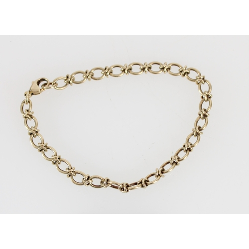 517 - 9ct gold cable link bracelet, 9.1g