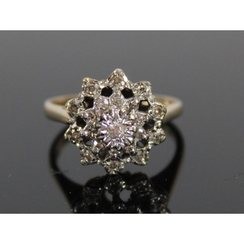 528 - 9ct gold and diamond ring, the 20 illusion set diamonds on tiered mount, 3.6g, size K/L