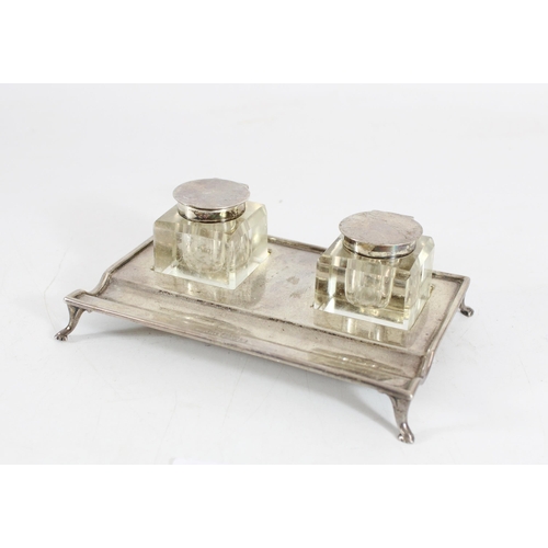 563 - George V ink stand, with silver base and silver topped glass inkwells, Chester 1923, W15cm, silver w... 