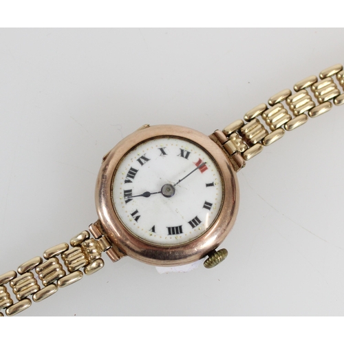 580 - c1920s ladies 9ct gold cased wristwatch on gold plated strap