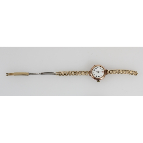 580 - c1920s ladies 9ct gold cased wristwatch on gold plated strap