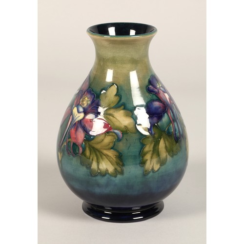 5 - Moorcroft pottery vase of baluster form, green/blue ground in the clematis pattern, signed in blue w... 