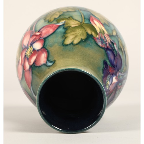 5 - Moorcroft pottery vase of baluster form, green/blue ground in the clematis pattern, signed in blue w... 