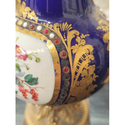 307 - Pair of Sevres style Continental porcelain vases decorated with panels of winged putti and objects o... 