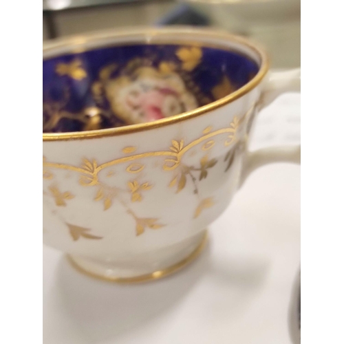 312 - Three early 19th century porcelain cabinet cups and saucers, decorated with hand painted pink cabbag... 