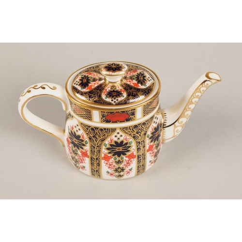 26 - Royal Crown Derby miniature tea service in the imari pattern, comprising of teapot, sugar bowl, crea... 