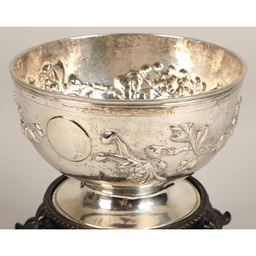 191 - Chinese embossed silver bowl, embossed with flowering prunus, raised on a circular base, maker Hung ... 