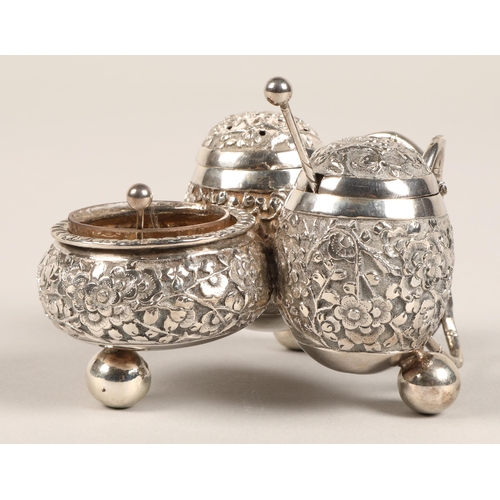 193 - Chinese silver condiment set, with embossed prunus decoration, maker Wan Hin, 134 grams.