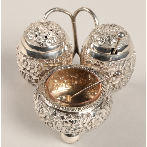 193 - Chinese silver condiment set, with embossed prunus decoration, maker Wan Hin, 134 grams.