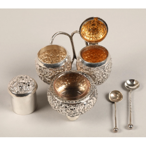 193 - Chinese silver condiment set, with embossed prunus decoration, maker Wan Hin, 134 grams.