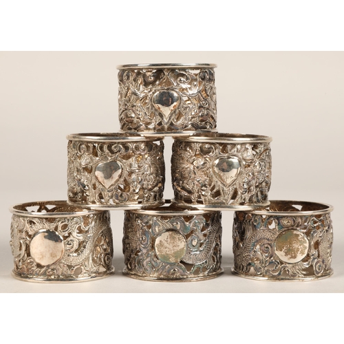 194 - Six chinese pierced napkin rings with dragon decoration, maker Wan Hin ,159 grams.