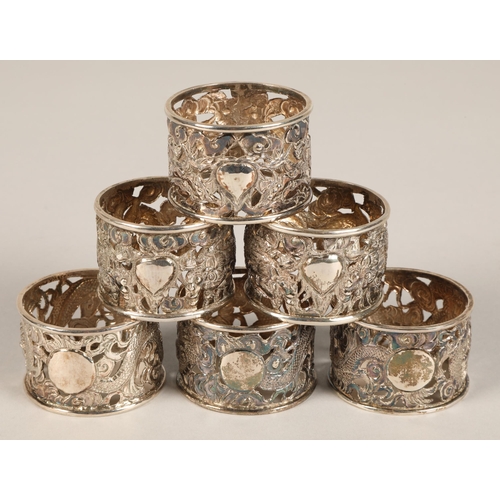 194 - Six chinese pierced napkin rings with dragon decoration, maker Wan Hin ,159 grams.