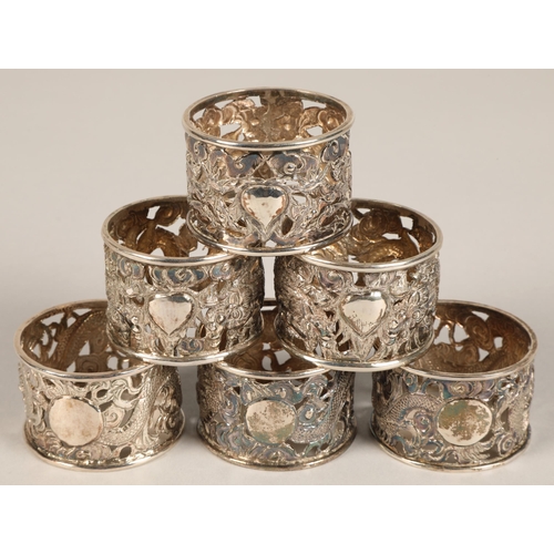 194 - Six chinese pierced napkin rings with dragon decoration, maker Wan Hin ,159 grams.