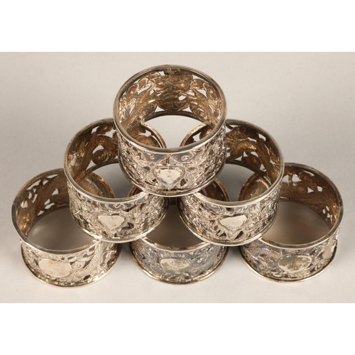 194 - Six chinese pierced napkin rings with dragon decoration, maker Wan Hin ,159 grams.