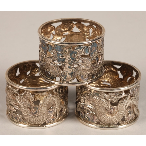 194 - Six chinese pierced napkin rings with dragon decoration, maker Wan Hin ,159 grams.