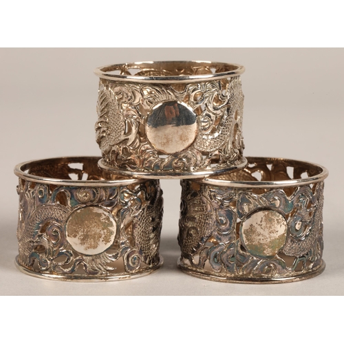 194 - Six chinese pierced napkin rings with dragon decoration, maker Wan Hin ,159 grams.