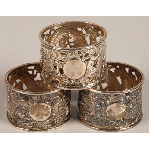 194 - Six chinese pierced napkin rings with dragon decoration, maker Wan Hin ,159 grams.