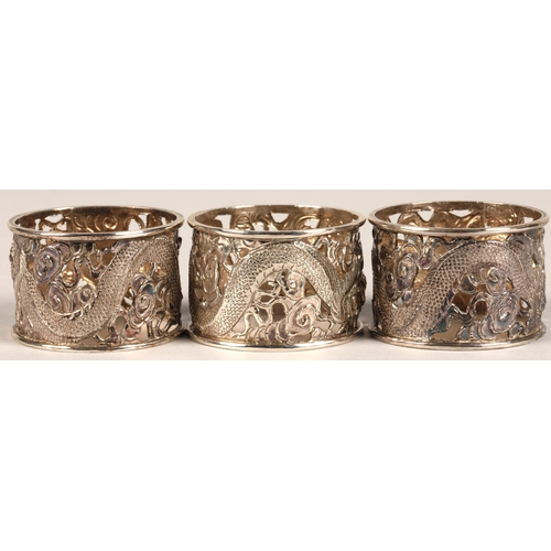 194 - Six chinese pierced napkin rings with dragon decoration, maker Wan Hin ,159 grams.