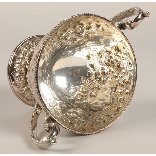 187 - Three piece silver plated tea service with embossed decoration.